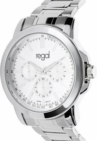 Silver watch with a metal band, featuring a white dial, three sub-dials, and a tachymetric scale. The brand name "regal" is displayed.