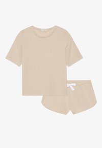Beige bomullsset för avkoppling som består av en T-shirt med kort ärm och rund hals samt matchande shorts med vit dragsko i midjan.