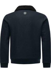 Navy blue sweatshirt with a textured black fur collar, featuring long sleeves, ribbed cuffs and hem, and a round logo at the back.