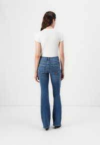 ONLY ONLBLUSH RHINESTON  - Flared jeans - medium blue denim