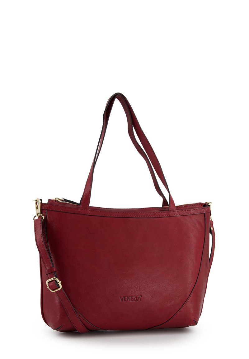 Red leather tote bag with dual shoulder straps, zippered top, and a subtle textured finish. Features a gold-tone hardware accent.
