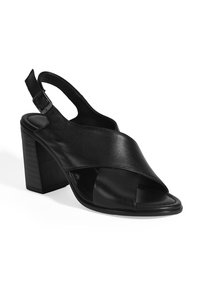 Zwarte leren sandalen met hak, slingback, gekruiste bandjes, open teen en een blokhak. Gladde textuur met minimale accenten.