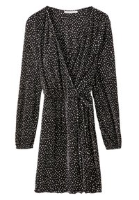 Robe noire cintrée à manches longues, ornée de pois blancs, avec un décolleté en V plongeant et un détail de taille nouée. Fabriquée en tissu doux et texturé.