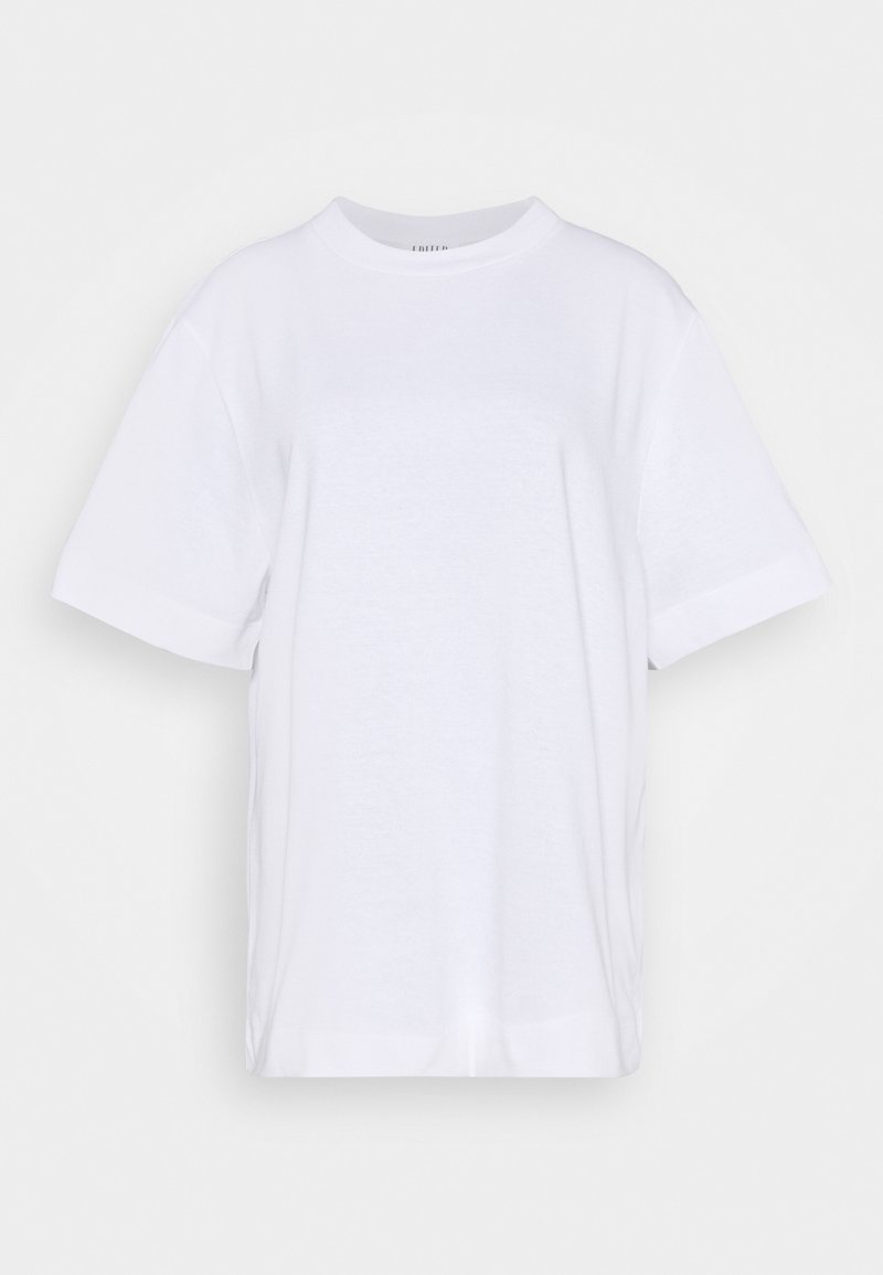 T-shirt blanc uni en coton à manches courtes, col rond et coupe décontractée sur fond uni.