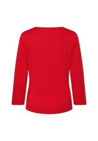 Rotes Langarmoberteil mit Rundhalsausschnitt. Hergestellt aus strukturiertem Stoff, mit lockerer Passform und geradem Saum, ohne Muster oder Verzierungen.