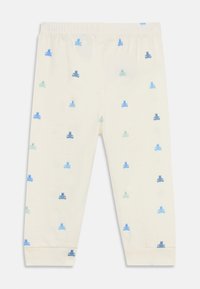 Leggings pour bébé couleur crème avec une taille élastique, ornés de petits ours en peluche bleus et teal.