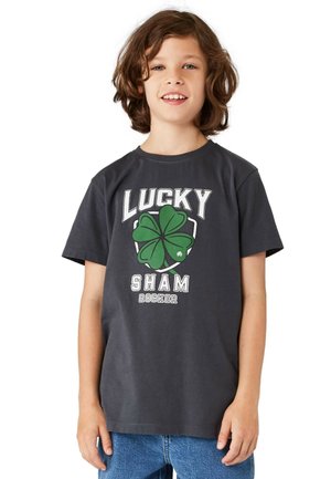 Gray cotton T-shirt featuring a green four-leaf clover graphic, bold white letters "LUCKY SHAM ROCKER," and a classic crew neck design.