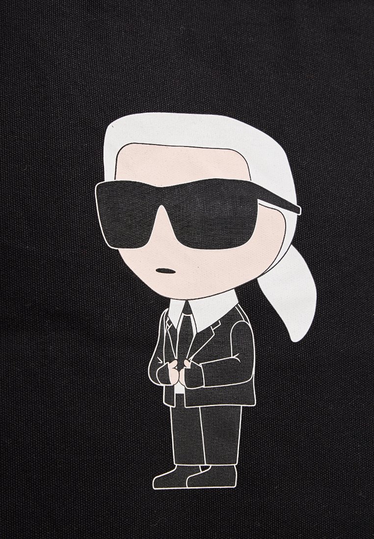 Cartoonfigur in einem weißen Anzug und schwarzen Sonnenbrille, mit einem Pferdeschwanz, vor einem schwarzen Hintergrund. Minimalistisches Design mit kräftigen Konturen.