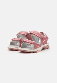 Pink sandals with a mesh upper, adjustable Velcro straps, cushioned insole, and a textured sole for grip. Designed for comfort and support.