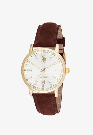 Orologio da polso con cassa in oro, quadrante bianco, indici dorati, datario a ore 6 e cinturino in pelle marrone.