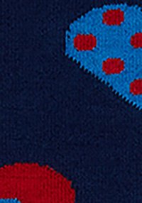 Navy background with large blue and red polka dot patterns, featuring a textured fabric that appears soft and knitted.