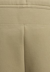 Nike Sportswear SPORTSWEAR TECH FLEECE - Tracksuit bottoms - neutral olive black