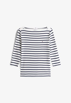 Fehér és tengerészkék csíkos hosszú ujjú felső, hajónyakú kivágással és kis logóval a mellkasnál. Puha pamut anyag, sima tapintású.