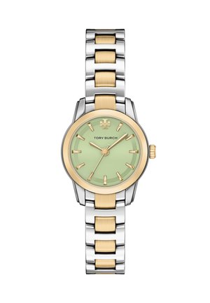 Tofarvet ur i sølv og guld med grøn urskive, gyldne timemarkører og Tory Burch-logo klokken 12.