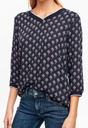 Navybluse mit V-Ausschnitt und Dreiviertelärmeln, ausgestattet mit einem floralen Muster in Pink und Weiß. Weicher Stoff mit einem lockeren Schnitt.