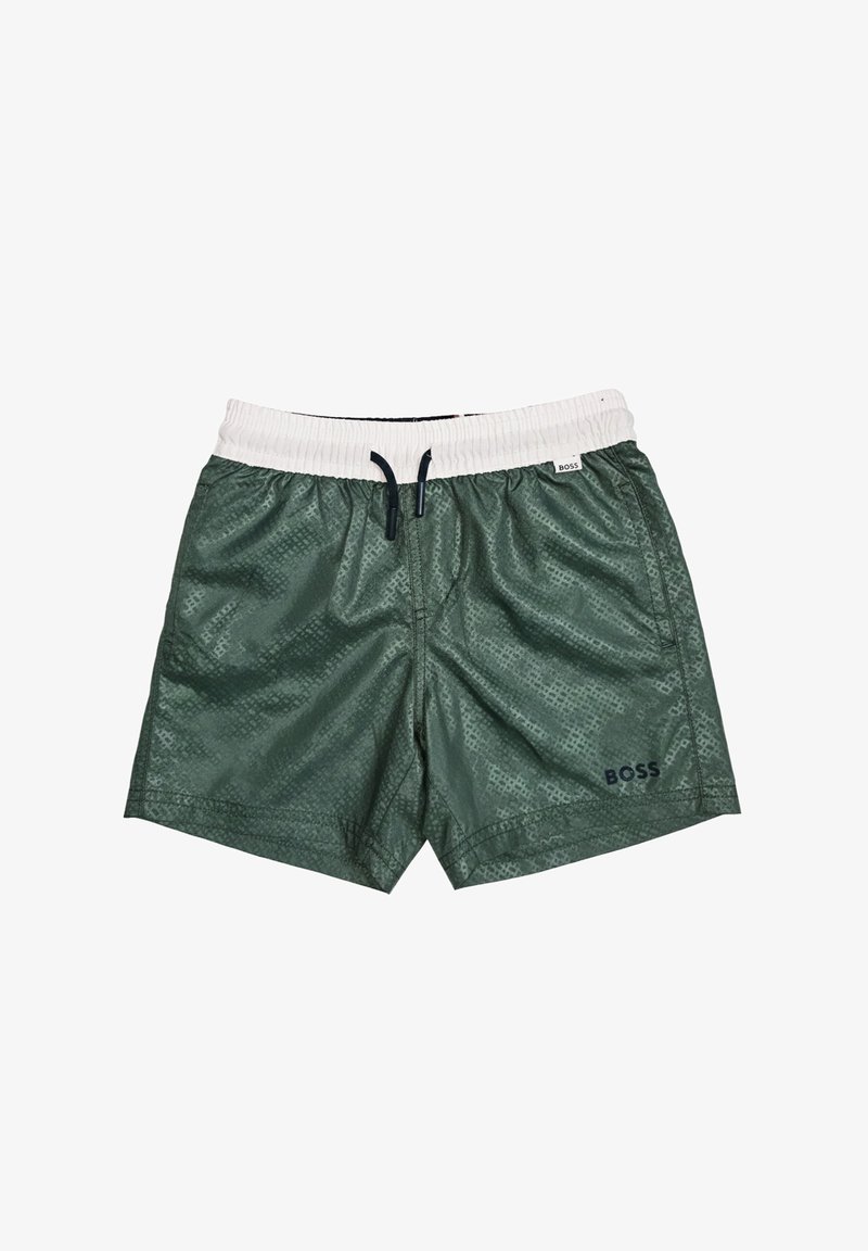 Shorts de bain verts à motifs avec une ceinture élastique blanche, un cordon noir, des poches latérales et le logo "BOSS" sur la jambe gauche.