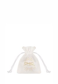 Small white drawstring pouch with gold "CHIC BY LIRETTE" text and decorative sunburst design, closed with white cords on either side.