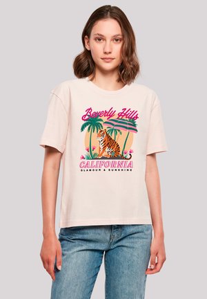 Light pink cotton t-shirt with short sleeves featuring a colorful graphic of a tiger, palm trees, and text "Beverly Hills California."
