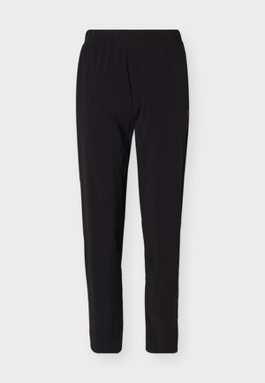 Zwarte, lichtgewicht broek met elastische taille en taps toelopende pijpen, ontworpen voor casual of sportief gebruik.