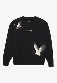 Black sweatshirt featuring two white cranes in flight with red accents. Text reading "KYOTO, JAPAN" printed below the design.