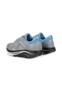 Gray athletic shoes with blue accents, featuring a textured upper, cushioned sole, and a wavy design on the side for enhanced grip.