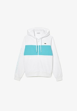 Sudadera con cremallera blanca que presenta una franja horizontal turquesa, bolsillos tipo canguro y un pequeño logo en el pecho. Incluye capucha con cordón.