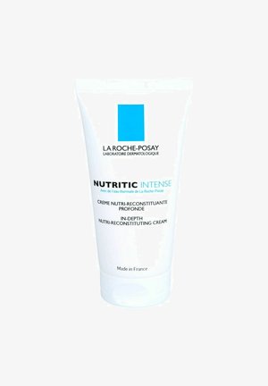 La Roche-Posay Nutritic Intense cream in a white tube, featuring a blue logo and text, with a smooth, glossy finish. Made in France.