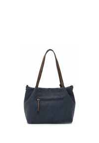 Marineblauwe handtas met bruine schouderriemen en een externe zak met ritssluiting aan de voorkant, weergegeven op een witte achtergrond.