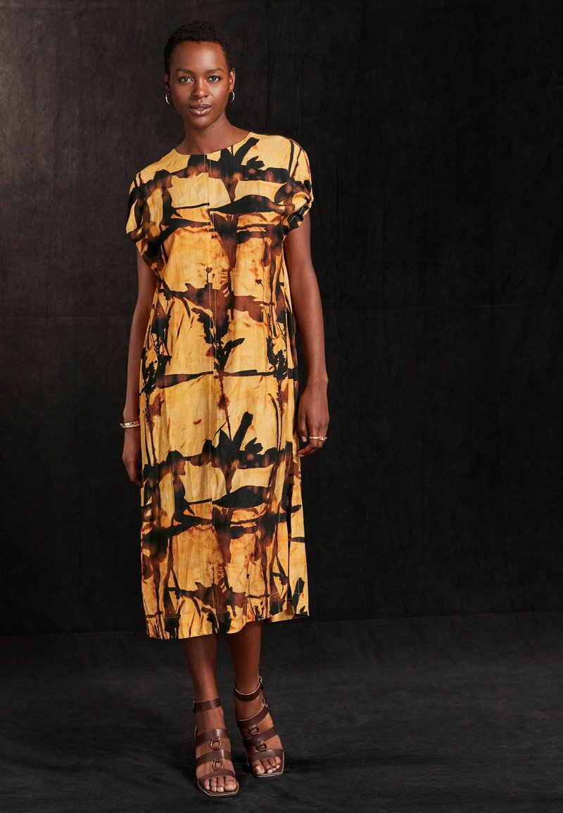 Next Päevakleit - ochre yellow and black print