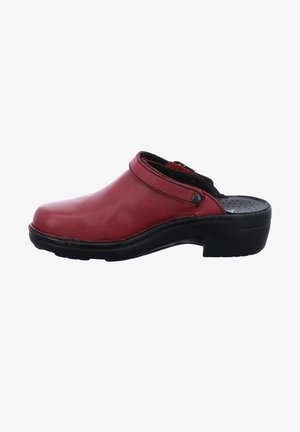 Red leather clogs with a rounded toe and a black rubber sole. Features a strap around the ankle with snap button closure. Smooth texture.