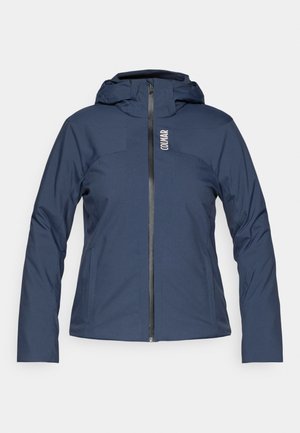 Navyblauwe, langmouwige jas met capuchon, voorzien van een voorrits, een gladde textuur en subtiele branding aan de bovenkant aan de linkerkant.