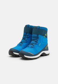 Blue hiking boots with synthetic upper, mesh accents, a padded collar, and rubber sole. Features laces, velcro strap, and contrasting green details.