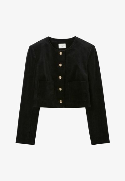 Giacca in corduroy nera con maniche lunghe, scollatura tonda, bottoni dorati e due tasche frontali. Design accorciato con texture a coste verticali.