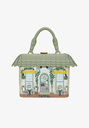 Borsa a mano a forma di vetrina di un caffè con tetto verde smerlato, tavoli, sedie, tende gialle e vigneti attorno alla porta e alle finestre.