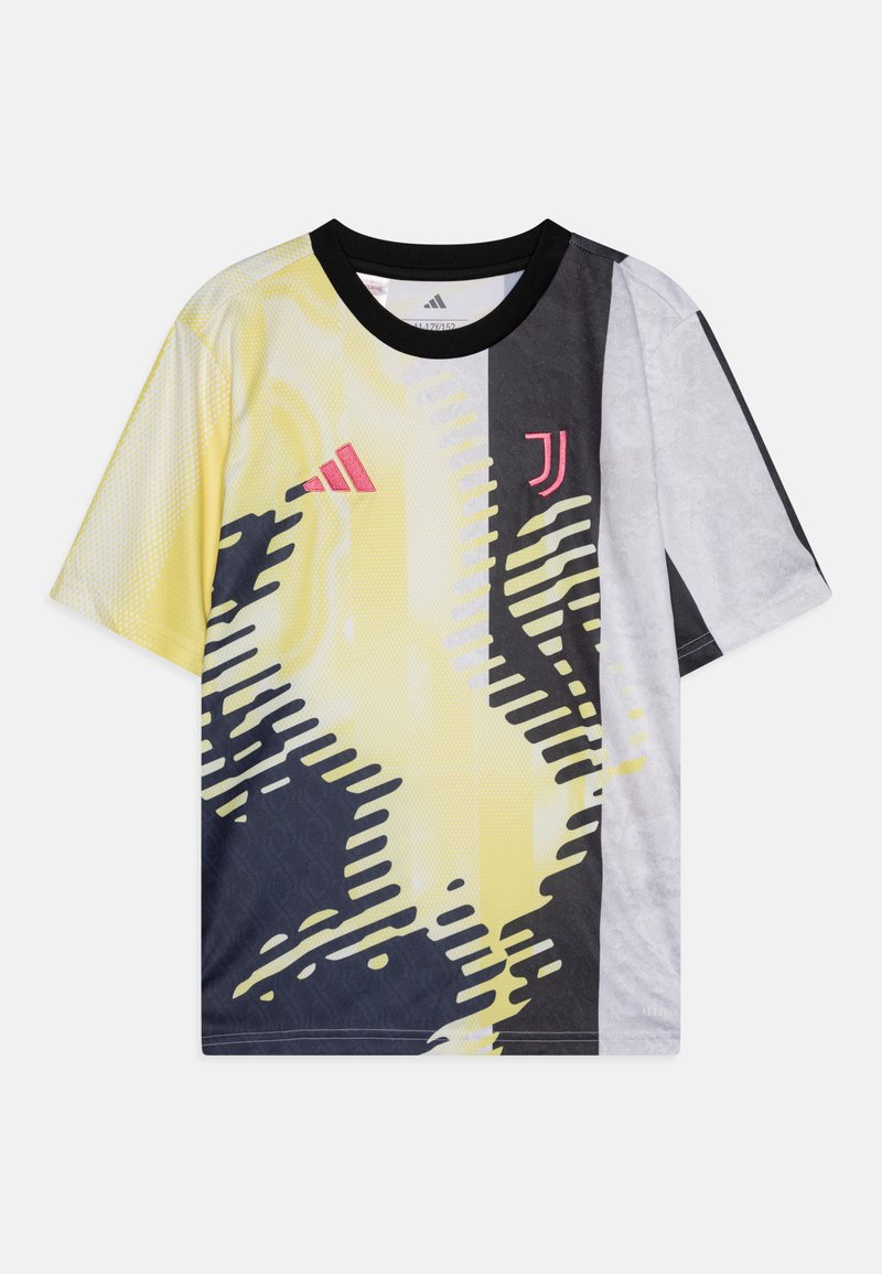Maillot à manches courtes jaune, noir et gris avec des motifs abstraits. Doté d'un col noir et d'un logo rose à l'avant. Tissu léger.