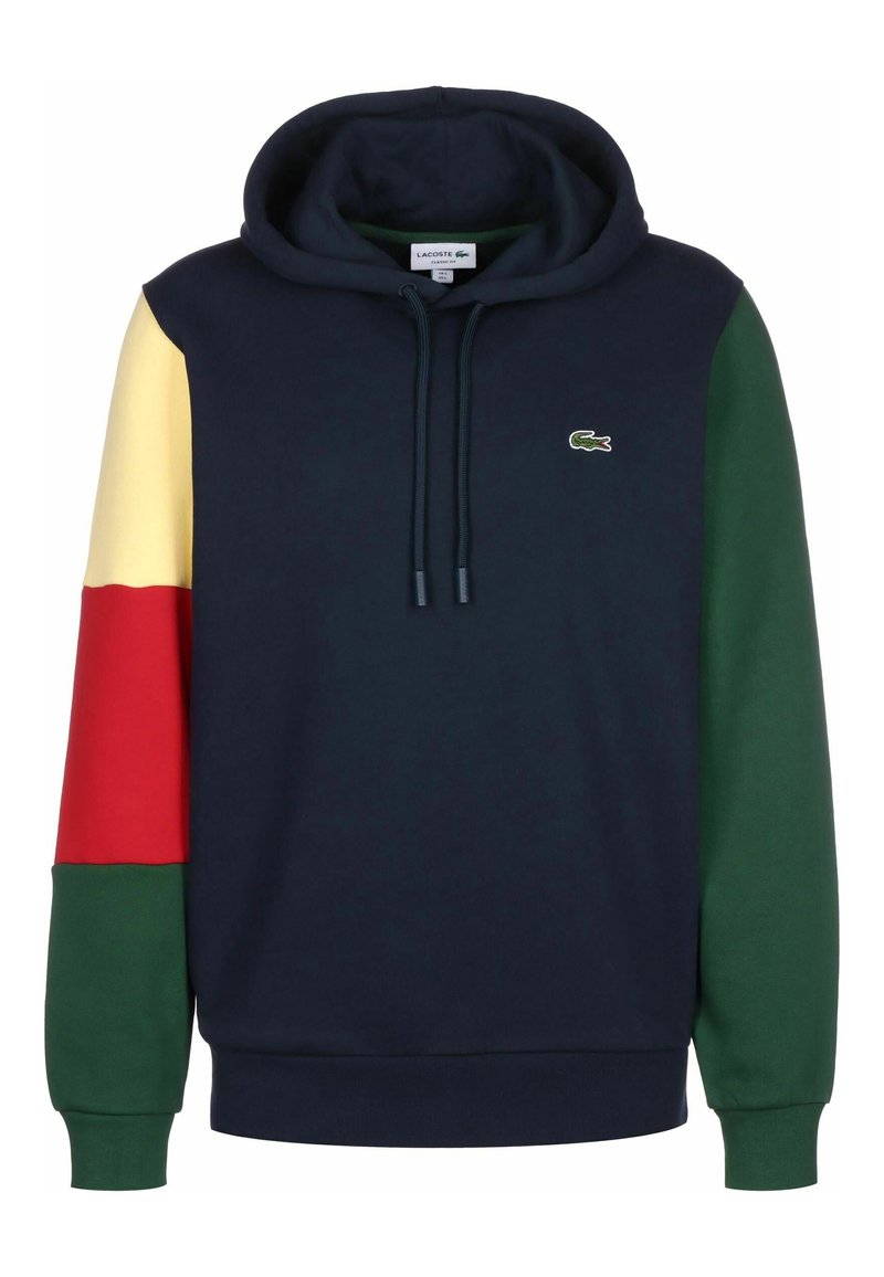 Sweat-shirt à capuche bleu marine avec des manches multicolores : jaune, rouge et vert. Doté d'un cordon de serrage et d'un petit logo sur la poitrine. Tissu confortable.