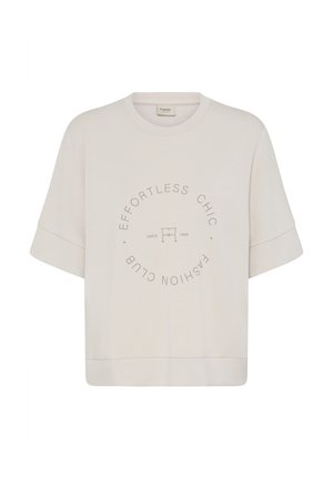 Béžová krátkym rukávom mikina s okrúhlym výstrihom a kruhovým nápisom "EFFORTLESS CHIC FASHION CLUB" okolo malého loga a "Since 1968."