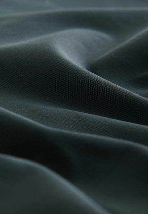 Dark green fabric with a smooth, slightly glossy texture, displaying gentle folds and fine ribbing throughout the surface.