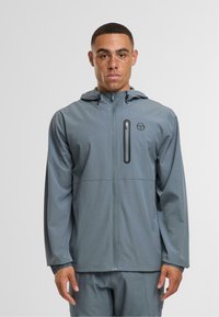 Lightweight grey jacket with a zipper closure, adjustable hood, and side zip pocket. Features smooth texture and minimal branding on the chest.