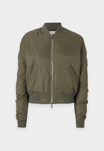 Olive green bomber jacket made from smooth fabric, featuring a zip closure, ribbed cuffs, and two side pockets.