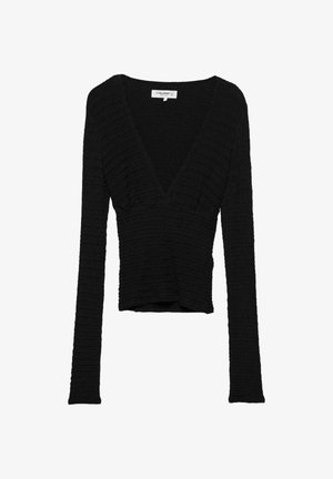 Haut enroulé noir en tissu texturé, avec des manches longues et un décolleté en V profond, présentant une silhouette courte.