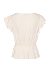 Blusa color pesche con maniche a volant corte e vita aderente. Texture liscia con vestibilità ampia e design a fondo svasato.