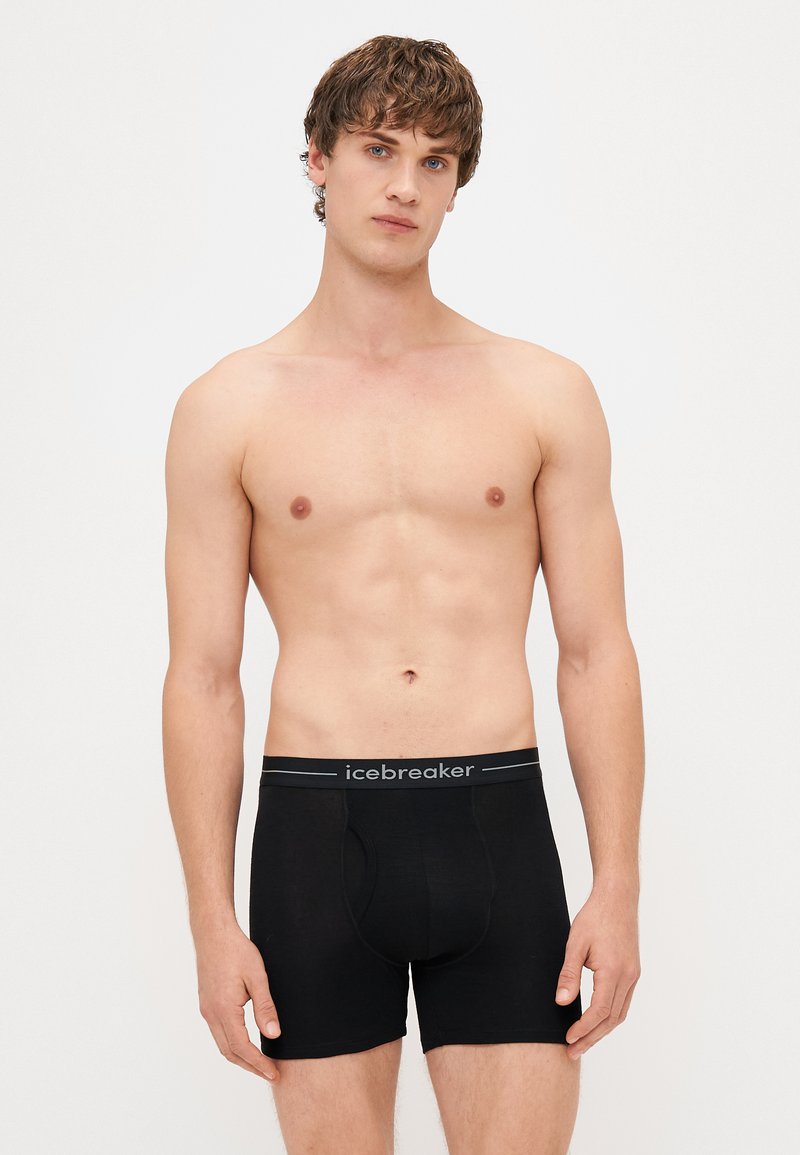 Boxer neri realizzati in materiale morbido, con un elastico in vita con il marchio "icebreaker". Il design è aderente e presenta una vita media.