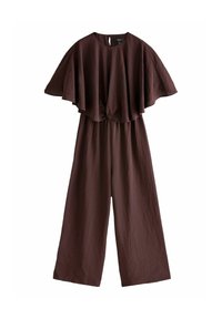 Brun jumpsuit med en svävande cape-liknande överdel, knuten detalj i fronten och vida byxor. Tillverkad av ett texturerat tyg med en subtil lyster.