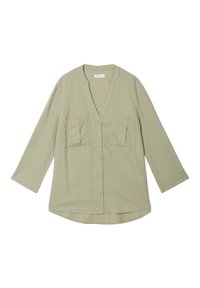 Chemise verte clair à boutons avec un décolleté en V, des manches trois-quarts et deux poches poitrine. Fabriquée dans un tissu texturé. Ourlet arrondi.