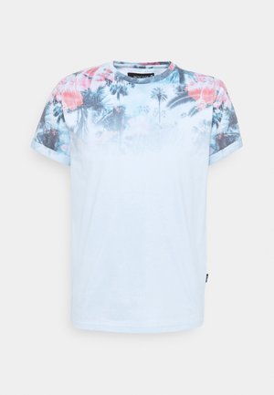 Light blue t-shirt featuring a floral print in pink and green on the shoulders. Short sleeves and a round neckline. Soft fabric texture.