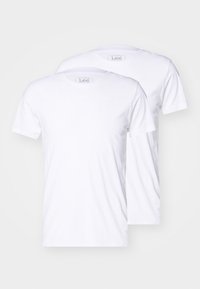 Two white cotton t-shirts with short sleeves, round necklines, and Lee branding on the tags. Smooth texture, classic fit, no additional patterns.