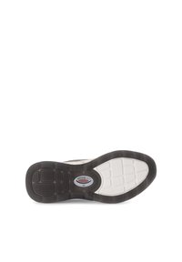 Sneakerzool met een gestructureerde rubberen onderkant, in een kleurenschema van wit en donkergrijs, met een klein logolabel en een patronen-loopvlak.