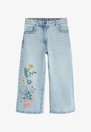 Jasnoniebieskie jeansy z denimu z wyszywanymi kolorowymi kwiatami i słowem "LES SOUFFLEURS" na lewej nodze, z guzikiem i przednimi kieszeniami.