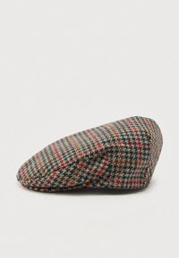 Sorică plată din țesătură tweed, cu un model houndstooth și carouri în nuanțe de verde, maro și roșu.
